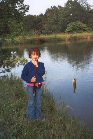 proudly displaying her fish