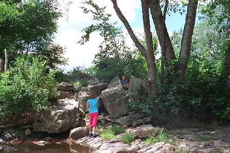 hiding and playing in the rocks