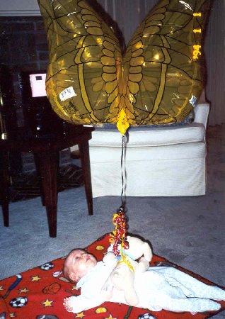 grandma gives kane some balloons