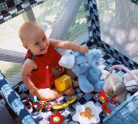kane in playpen on the porch