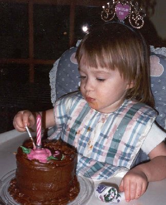 elaine second birthday eating her cake