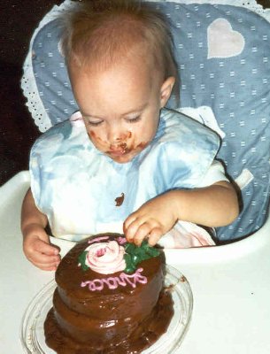 grace first birthday with cake