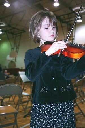 elaine playing viola in school concert